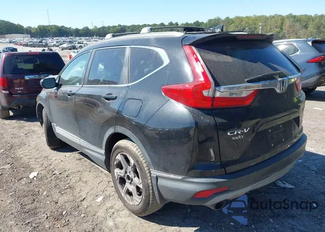 2018 Honda Cr-V Touring z USA, uszkodzony, nr VIN 7FARW2H94JE099983